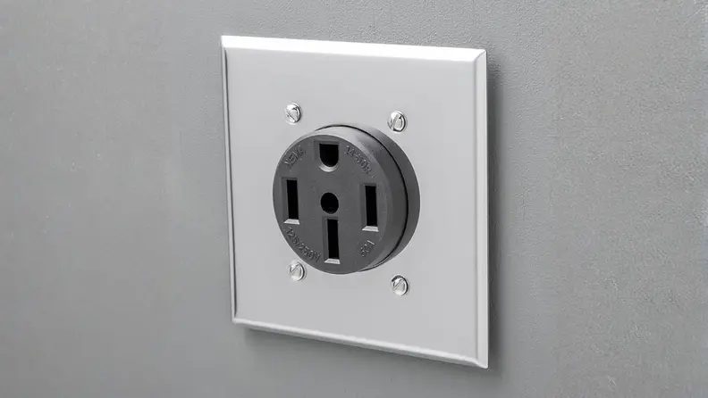 NEMA 14-50 outlet on a gray wall