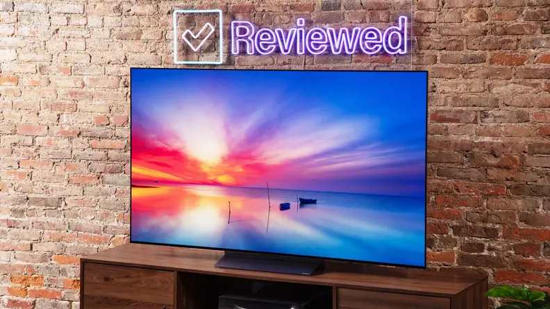 Angled photo of the LG C3 OLED TV showing a vibrant, multicolored sky.