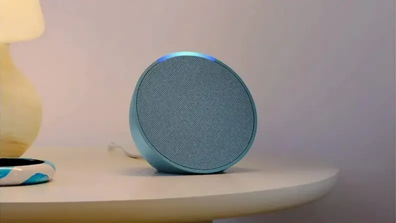 An Alexa on a nightstand.
