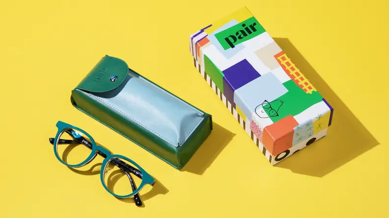 Eyeglasses and case on yellow background
