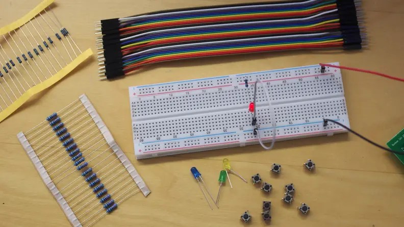 Components of the Boolean Box include a breadboard, wires, resistors, push buttons, and LEDs.