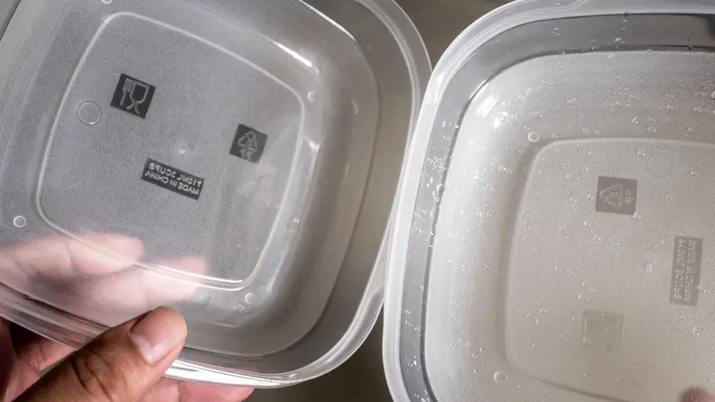 On the right, is a plastic container that underwent CrystalDry and the other a normal dishwasher cycle.