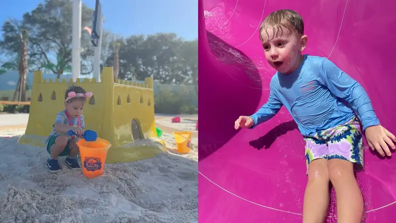A toddler plays in the sand and goes down a water slide at the Peppa Pig Theme Park in Florida