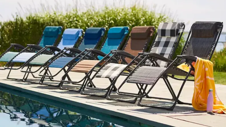Multi-colored Kohl’s Sonoma Goods For Life regular antigravity chairs lined up on pool deck.