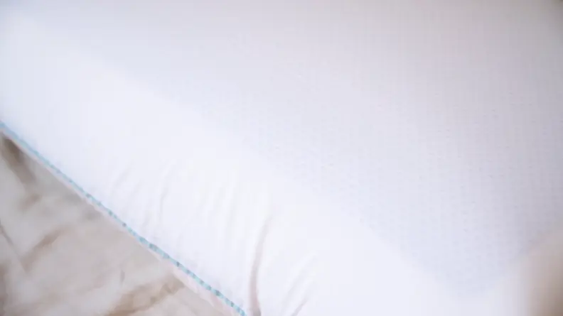 the surface of the tempur-cloud dual breeze pillow with visible cooling gel beneath the cotton surface