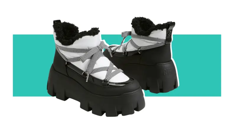 A pair of puffy boots that are black and white.