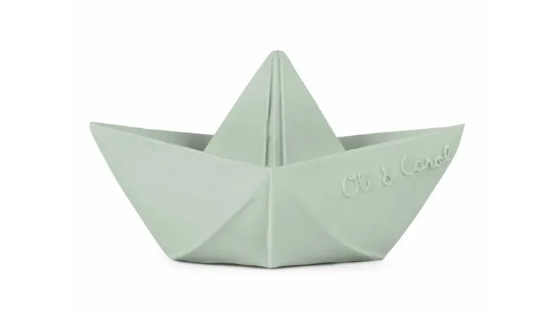 An origami-style toy boat made from natural rubber in a light mint green color.