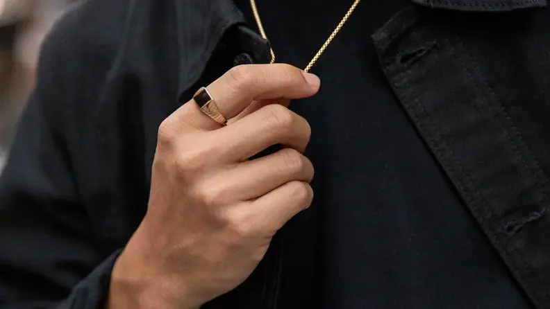 Man wearing gold jewelry