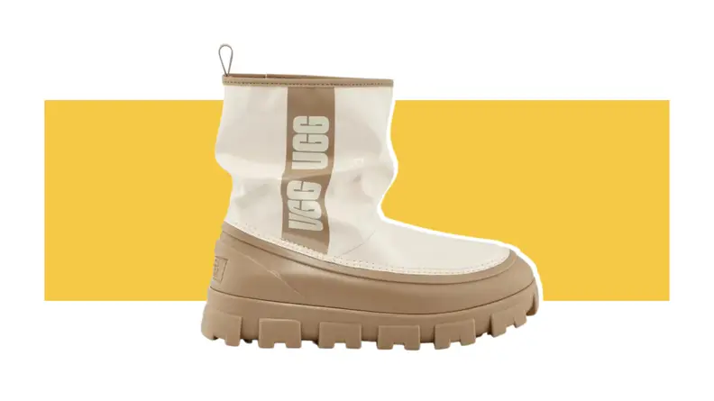 Cream and tan Ugg Brellah Mini against a yellow background
