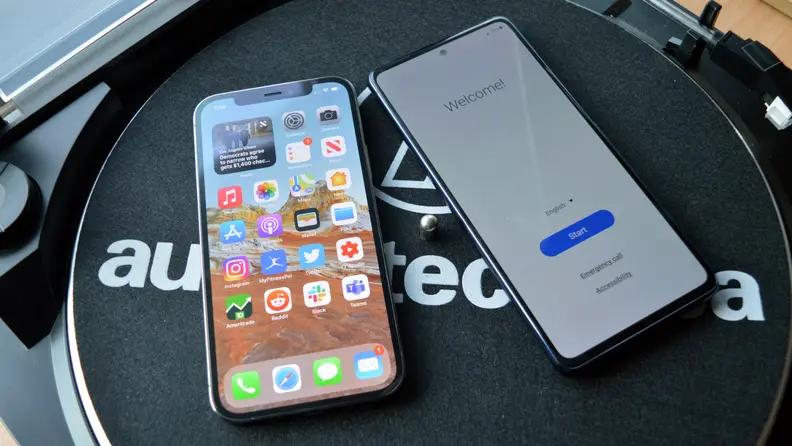 An iPhone and an Android phone lying side by side