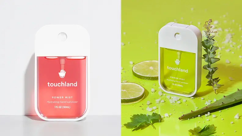 On the left: A bottle of Touchland spray santizer with a pink liquid inside it. On the right: A bottle of the sanitizer with a green liquid in it and green fruits around the bottle.