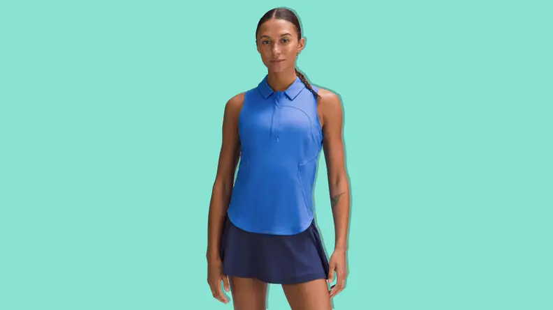 A woman wearing a blue lululemon Women's Swiftly Tech Short-Sleeve Half-Zip Polo Shirt on a teal background.