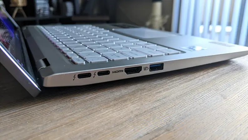 The side of the Acer Swift 3 OLED, showing off the USB port, HDMI port and charging ports.