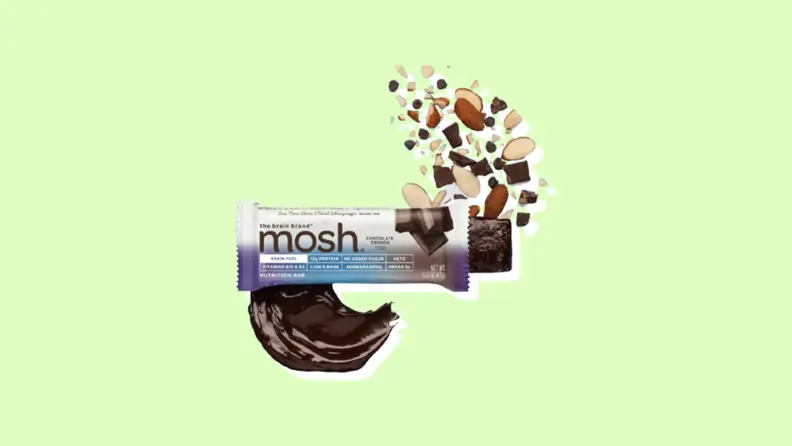 The Brain Brand's Mosh bar with variety of nuts and seeds next to it.