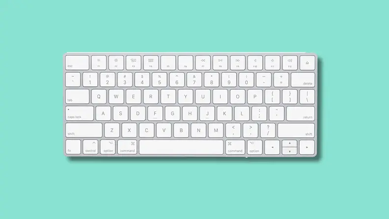 The Apple Magic Keyboard on a green background.