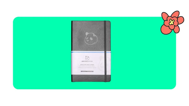Black productivity journal on green background