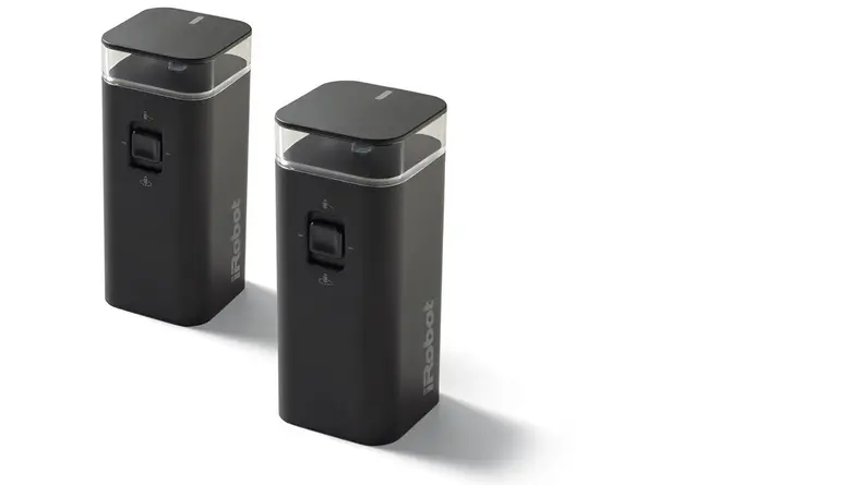 Two black boxes with buttons in the center and the iRobot logo on the side.