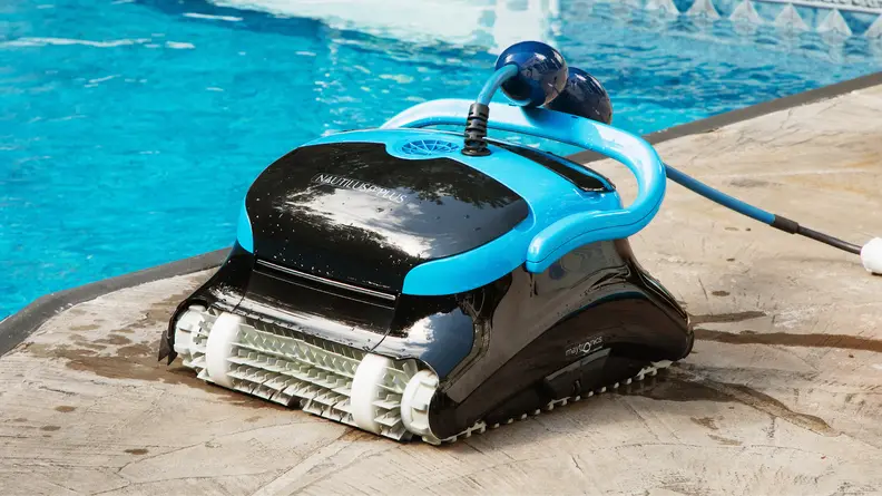 The Dolphin Nautilus CC Plus Wi-Fi sitting next to a swimming pool.