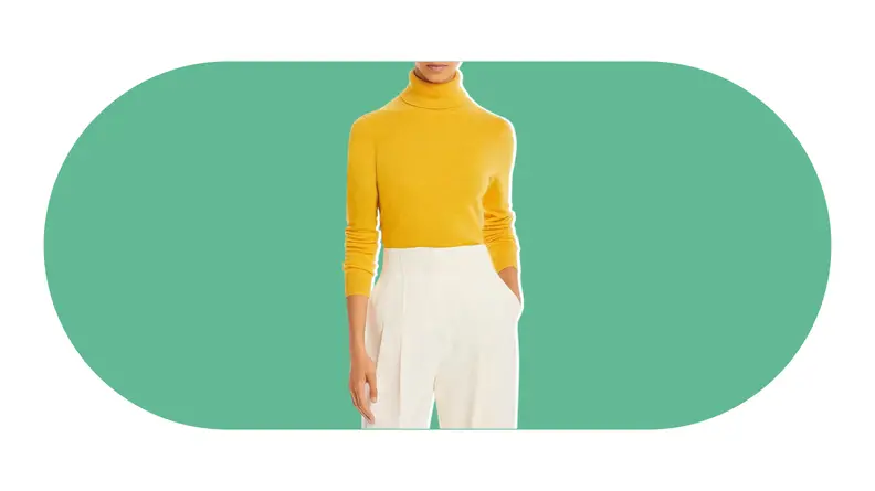 A model wearing a yellow cashmere turtleneck sweater.