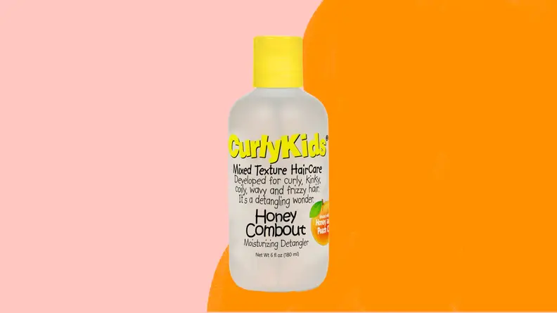 A bottle of CurlyKids shampoo on an orange and pink background.