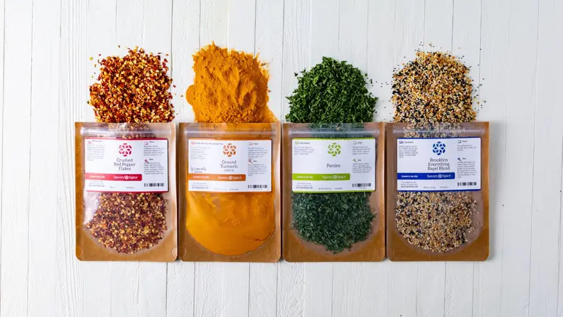 Four bags of spilled Savory Spice's side-by-side.