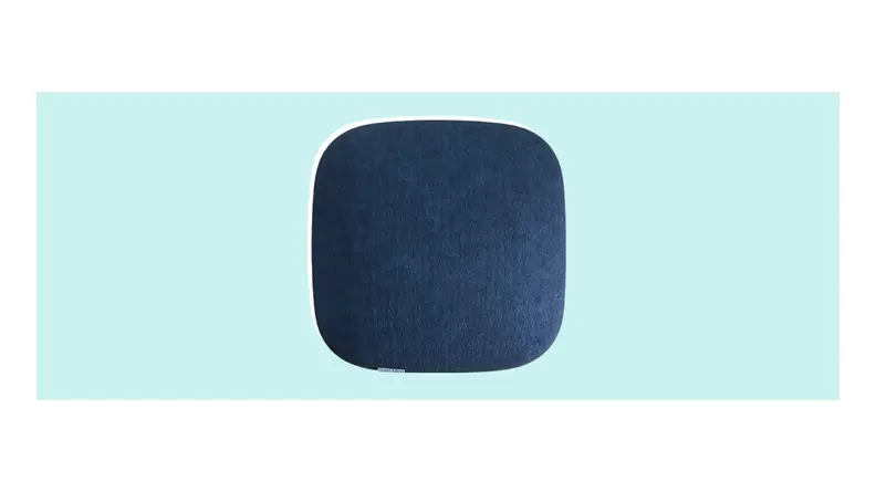 A dark blue, rectangular Quiet Mind Pillow with rounded edges.