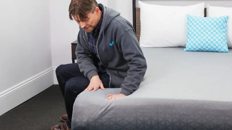 A man sitting on a Zoma hybrid.