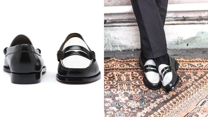 pair of black and white colorblock Weejuns, person standing in black slacks wearing colorblock Weejun penny loafers