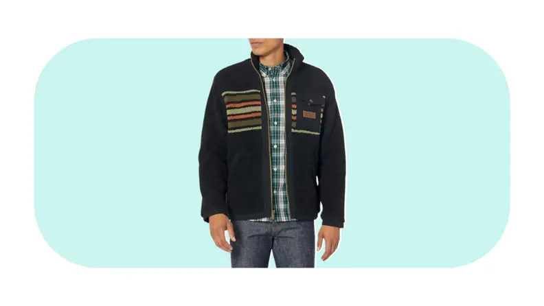 A model wearing a fleece jacket with a multi-colored stripe print.