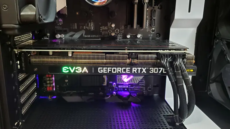 The PC is lit with RGB on the graphics card and CPU cooler