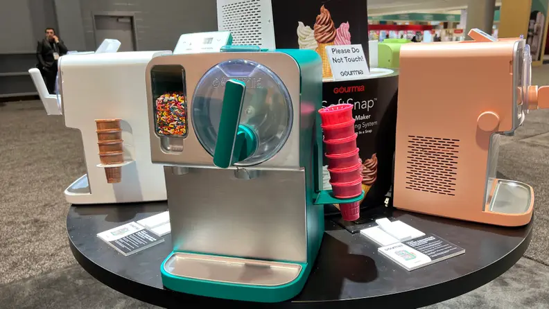 Gourmia SoftSnap machines in different colors arranged on a circular table.