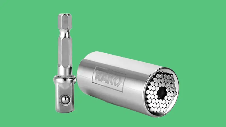 Steel socket tool on green background