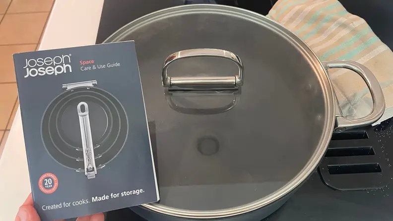 A close-up of a glass lid that goes to a 5-quart shallow casserole pan.