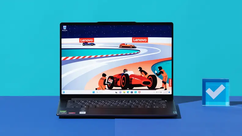 An open and powered on laptop showing a red race car on its screen against a blue backdrop.