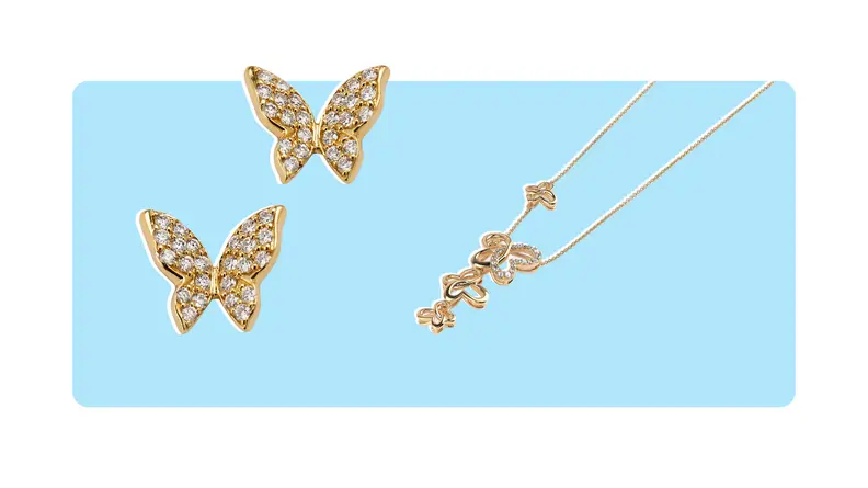 A pair of gold, diamond-encrusted butterfly stud earrings, and a gold drop necklace with a four-butterfly pendant.