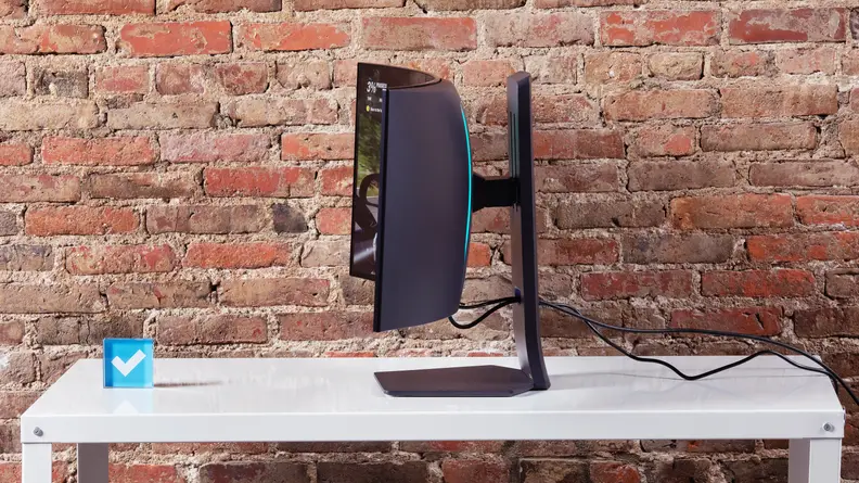 The LG UltraGear OLED 34GS95QE-B monitor in profile showing how curved the panel is.