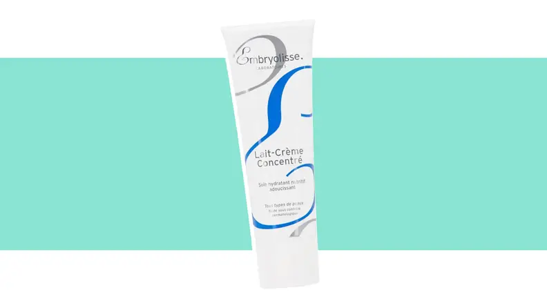 A tube of skin lotion against a green background.