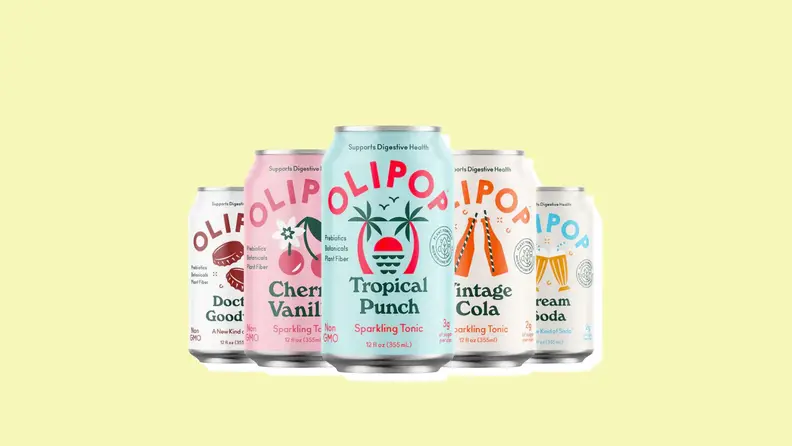 Five flavors of Olipop cans on a yellow background.