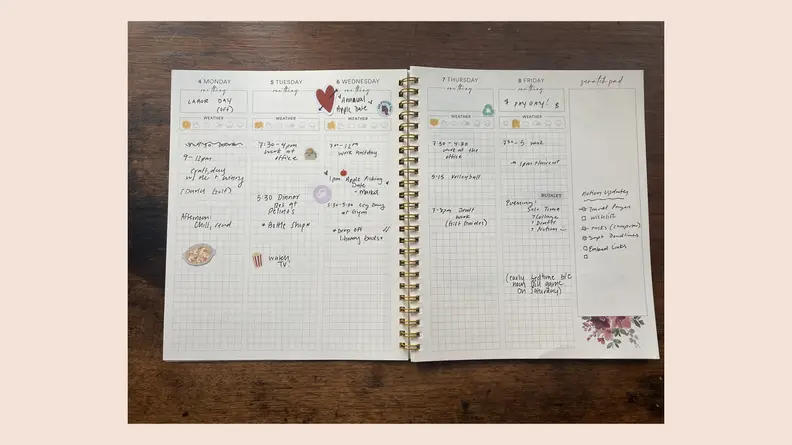 open journal on pink background