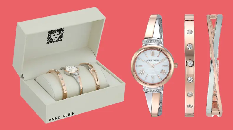 A roman numeral watch in golf and silver with small diamond accents and two other band options.