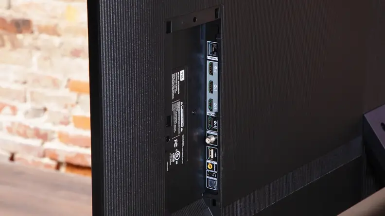 A close-up of the connectivity ports on the back of a TCL QM8 LED TV.