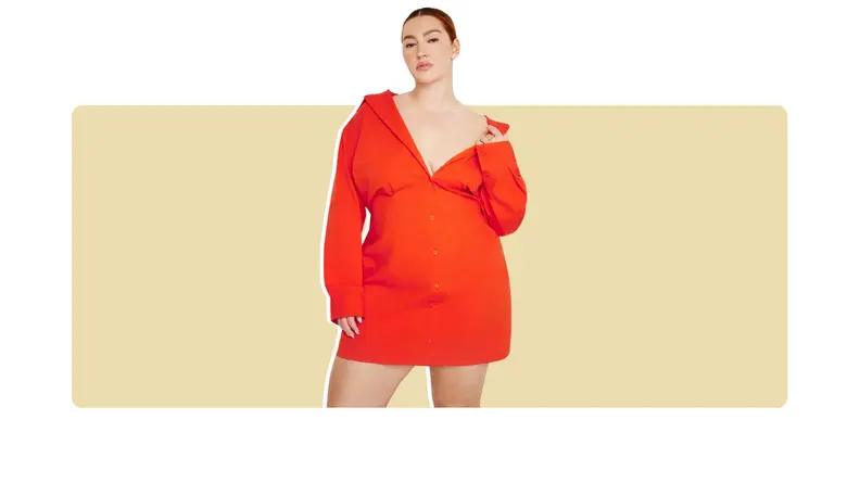 A bright red-orange shirt dress that has an off-the-shoulder design.