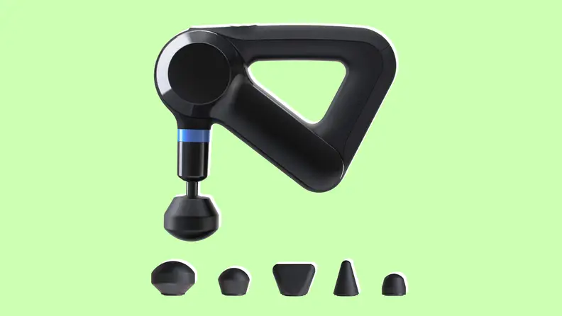 Theragun elite massage gun on light green background