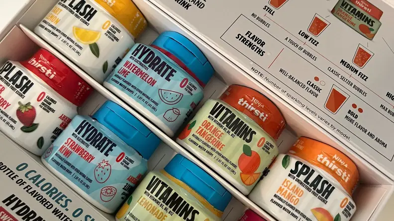 An opened box of varying Thirsti flavor drops, including flavors from the Hydrate, Splash, and Vitamins lines.
