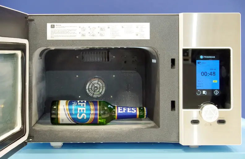 Frigondas Microwave Freezer with a cold beer inside