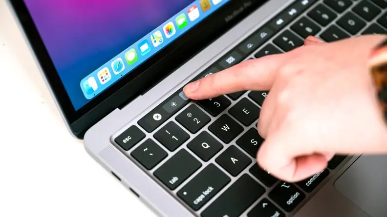 Person slides on Touch Bar using a finger