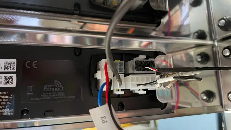 The wiring inside a Weber smart grill.