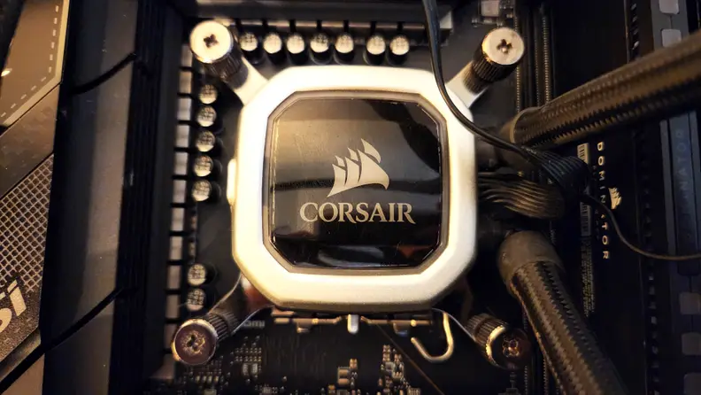 A top-down photograph of an all-in-one processor cooling pump block.