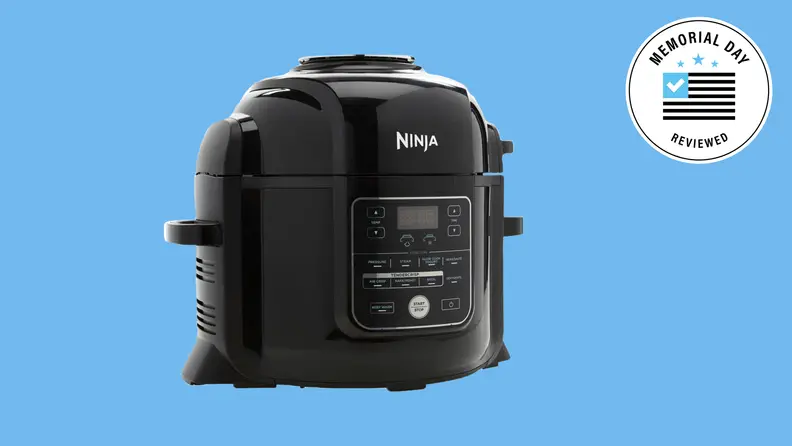 A Black Ninja multicooker against a blue background.