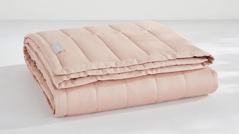 The Casper Weighted Blanket comes in pretty colors like this blush pink.